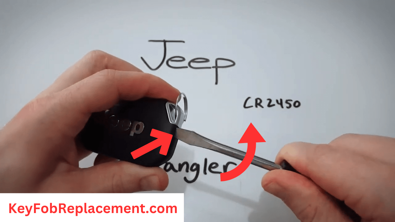 Jeep Wrangler Use screwdriver to open key fob and remove carefully