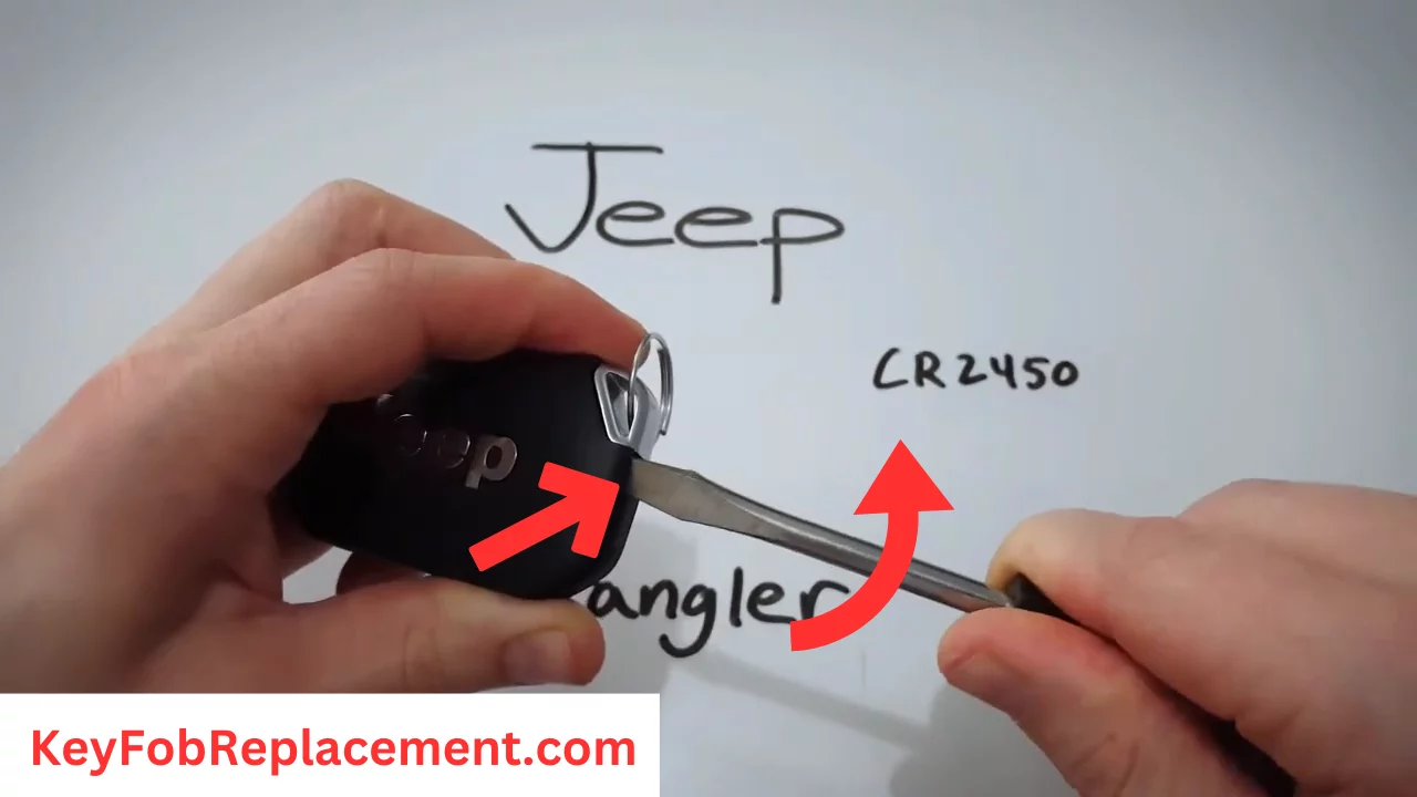 Jeep Wrangler Use screwdriver to open key fob and remove carefully