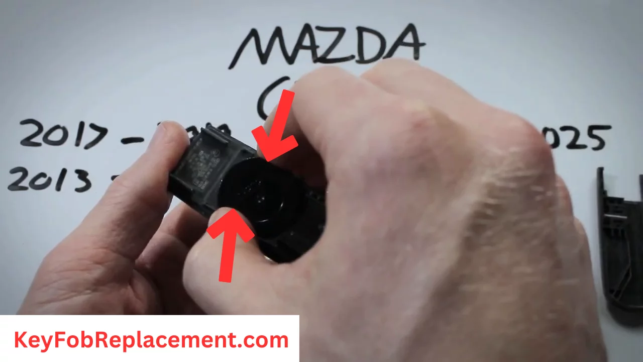 Mazda CX-5 Key Remove plastic cover, take out battery