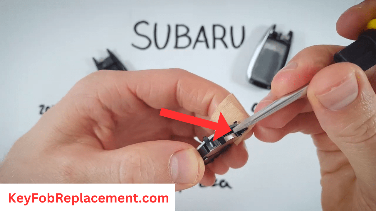 Subaru Impreza Silver Sides Insert screwdriver to remove battery