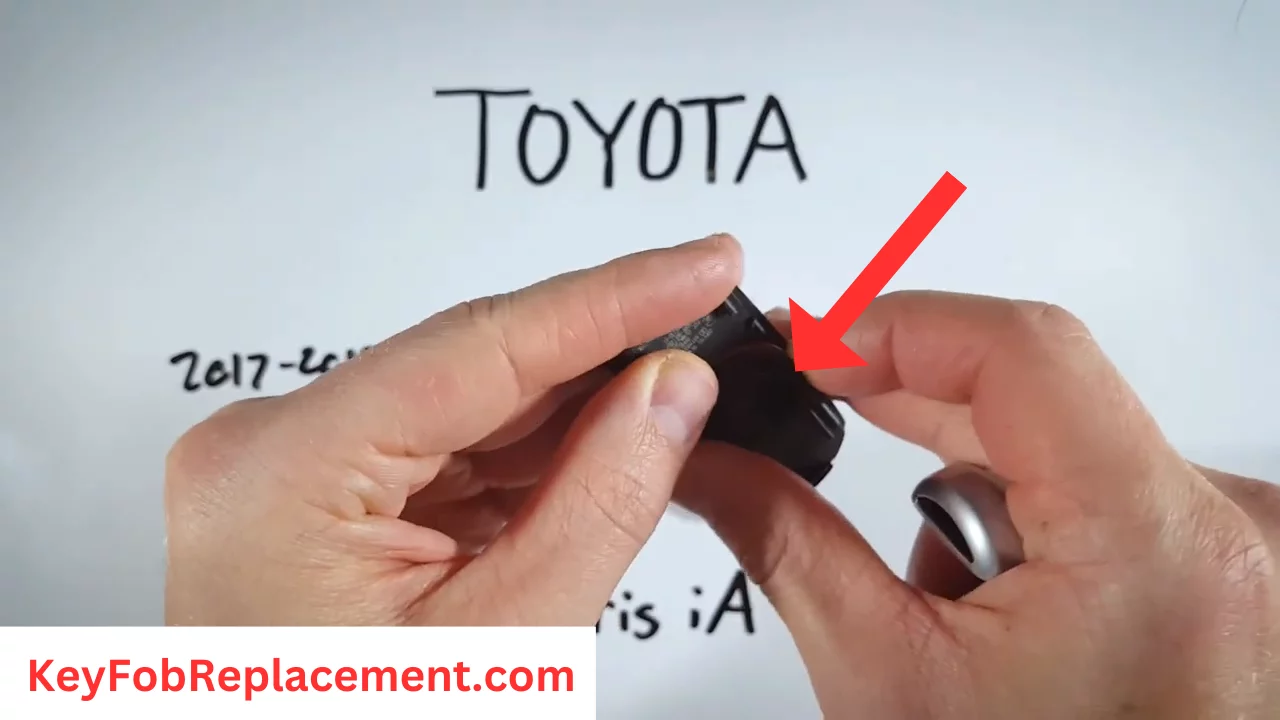 Toyota Yaris iA Remove plastic disc from battery cover